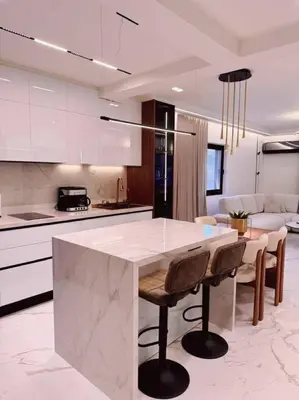 a kitchen with a table and chairs in a room at EcoStay Celebrity 2 BDR luxurious apartment by the sea# in Athens