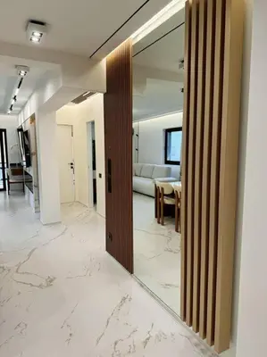 a hallway with a mirror and a living room at EcoStay Celebrity 2 BDR luxurious apartment by the sea# in Athens