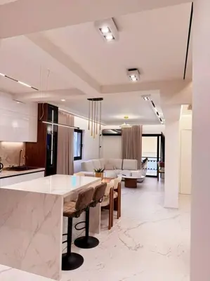 a kitchen and living room with a table and a couch at EcoStay Celebrity 2 BDR luxurious apartment by the sea# in Athens