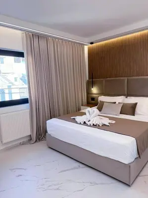a bedroom with a large bed and a large window at EcoStay Celebrity 2 BDR luxurious apartment by the sea# in Athens