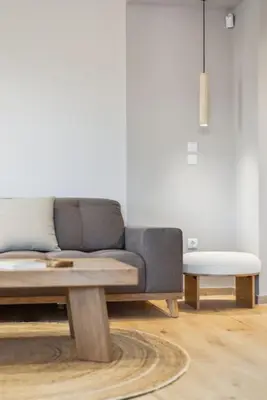 a living room with a couch and a coffee table at Three-Bedroom Elegant City Living in Athens