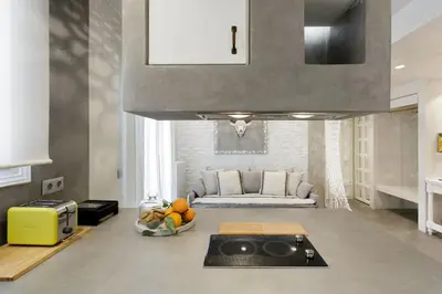 a living room with a couch and a bowl of fruit at Stylish, Quiet & Relaxing, a Hidden Gem near the Acropolis in Athens