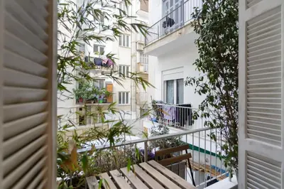 a balcony with a bench in front of a building at Stylish, Quiet & Relaxing, a Hidden Gem near the Acropolis in Athens