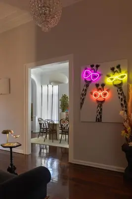 a living room with a pair of glasses on the wall at House of Andele in Athens