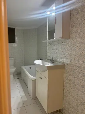 a bathroom with a sink and a tub and a toilet at Zografou centre apartment in Athens