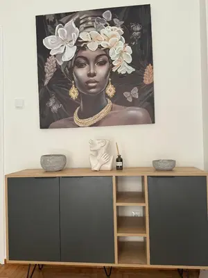 a painting of a woman with a flower on her head at Zografou centre apartment in Athens