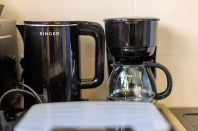 a coffee pot sitting on top of a stove at AIOLOS elegant escapes GLYFADA apartment in Athens