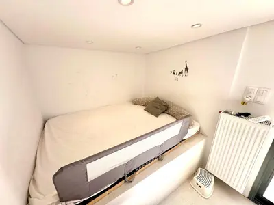 a bedroom with a bed in a small room at Luxury 6 bedroom 4 bathroom villa with pool in Vari