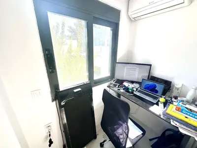 an office with a desk with a laptop and a computer at Luxury 6 bedroom 4 bathroom villa with pool in Vari