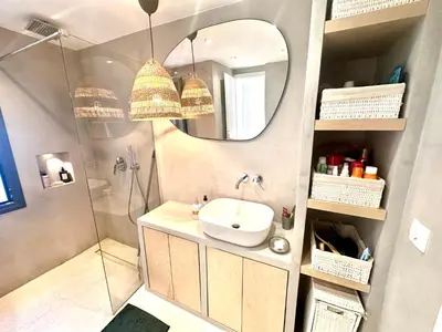 a bathroom with a sink and a shower and a mirror at Luxury 6 bedroom 4 bathroom villa with pool in Vari