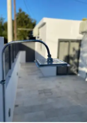 a metal object sitting on the side of a building at Luxury 6 bedroom 4 bathroom villa with pool in Vari