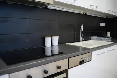 a kitchen with a sink and a counter top at 2BR Apartment next to the Metro station in Athens