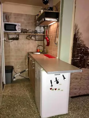 a small kitchen with a counter and a sink at 500Mbps WiFi Budget Studio 1min from Attiki metro station in Athens