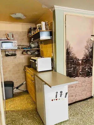 a small kitchen with a counter in a room at 500Mbps WiFi Budget Studio 1min from Attiki metro station in Athens