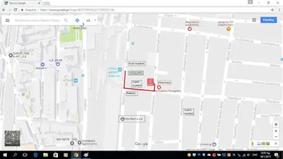 a screenshot of a google map with a red arrow at 500Mbps WiFi Budget Studio 1min from Attiki metro station in Athens