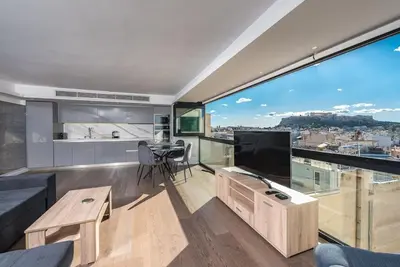 a living room with a large view of a city at Unique Acropolis View Apartment in Athens