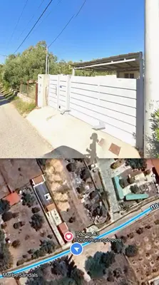 a picture of a backyard with a fence at Fanis Rooms in Aghia Marina