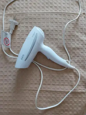 a nintendo wii game controller with a white cord at LEONEG corner in Athens
