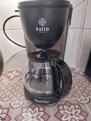 a black blender sitting on top of a table at LEONEG corner in Athens