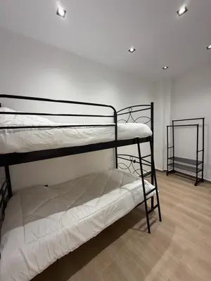 a room with two bunk beds in a room at Harmony Twin Lofts Metaxourgeio 1 in Athens