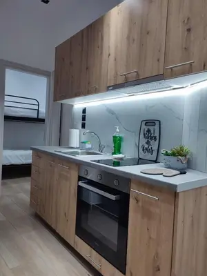 a kitchen with a sink and a stove at Harmony Twin Lofts Metaxourgeio 1 in Athens