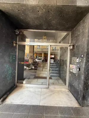an open door to a building with graffiti on the wall at Acropolis Harmony Loft in Athens