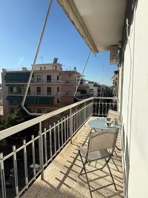 a balcony with a table and a chair at Acropolis Harmony Loft in Athens