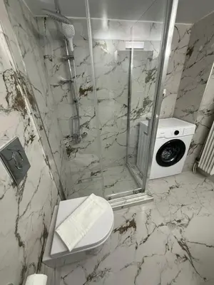 a bathroom with a shower and a toilet and a sink at Acropolis Harmony Loft in Athens