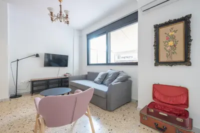 a living room with a couch and a table at zen- open space in Athens