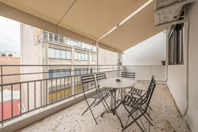 a balcony with a table and chairs on it at Zen Spacious, Psirri in Athens