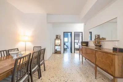 a dining room with a long table and chairs at Zen Spacious, Psirri in Athens