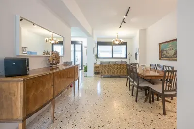 a dining room with a table and a mirror at Zen Spacious, Psirri in Athens