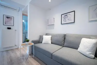 a living room with a couch and a table at Stylish apartment at Exarchia in Athens