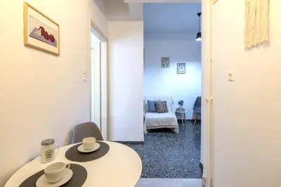a room with a table with two hats on it at Your perfect choice for stay in Athens in Athens