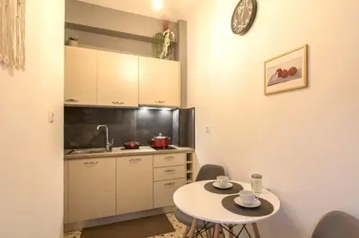 a small kitchen with a table and a sink at Your perfect choice for stay in Athens in Athens