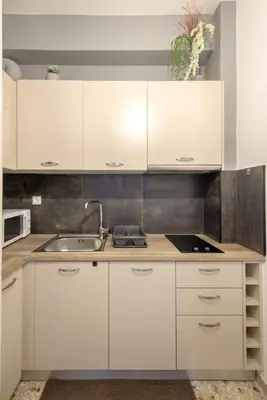 a kitchen with white cabinets and a sink at Your perfect choice for stay in Athens in Athens