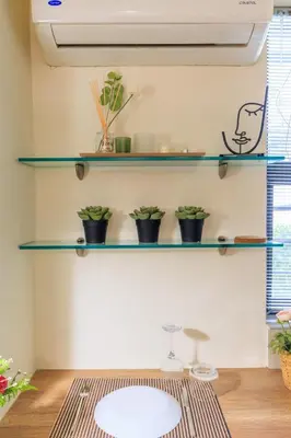 a room with shelves on the wall with a table at AIOLOS glyfada centre apartment 1 in Athens