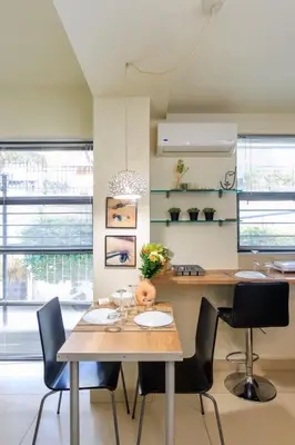 a dining room with a table and chairs at AIOLOS glyfada centre apartment 1 in Athens