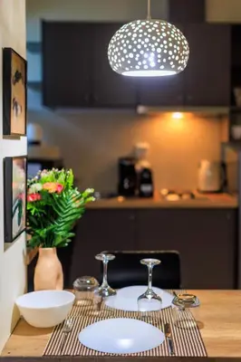 a table with two wine glasses on top of it at AIOLOS glyfada centre apartment 1 in Athens