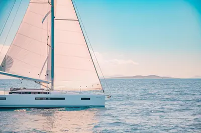 a sailboat on the water in the ocean at Luxury Sailing Cruises in Athens with Traditional Greek Cuisine and Drinks in Athens