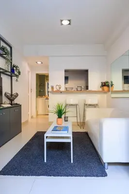 a living room with a couch and a table at AIOLOS glyfada centre apartment 2 in Athens