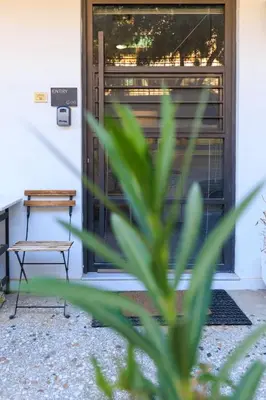 a bench in front of a door at AIOLOS glyfada centre apartment 2 in Athens