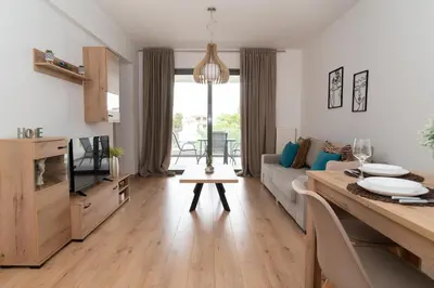 a living room with a couch and a table at Elegant apartment in Agia Paraskevi-B2 in Athens