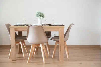 a dining room table with four chairs and a table at Elegant apartment in Agia Paraskevi-B2 in Athens
