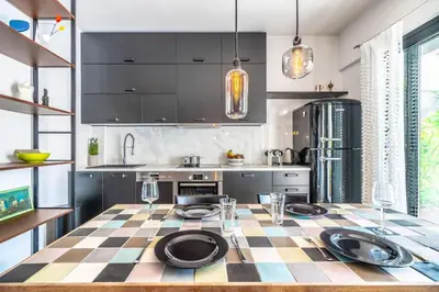 a kitchen with a checkered table with plates on it at Stylish 2bed home in Syntagma area in Athens