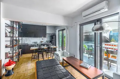 a kitchen and living room with a table and chairs at Stylish 2bed home in Syntagma area in Athens