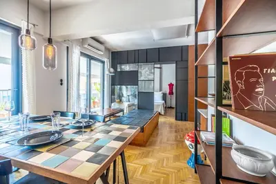 a dining room with a checkered table in a room at Stylish 2bed home in Syntagma area in Athens