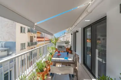 an apartment balcony with a table and chairs at Stylish 2bed home in Syntagma area in Athens