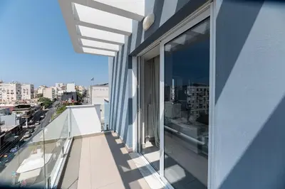 a balcony of a building with a view of a city at City-View Apartment by Piraeus Port - DRF2 in Piraeus