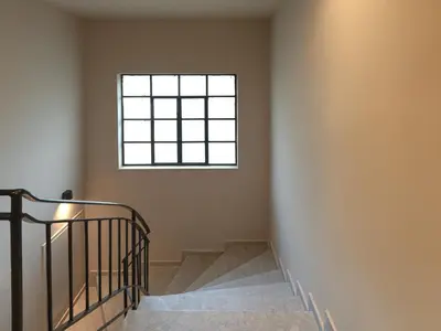a staircase with a window in a building at YaPe Coastal Suites at Alimos Beach in Athens